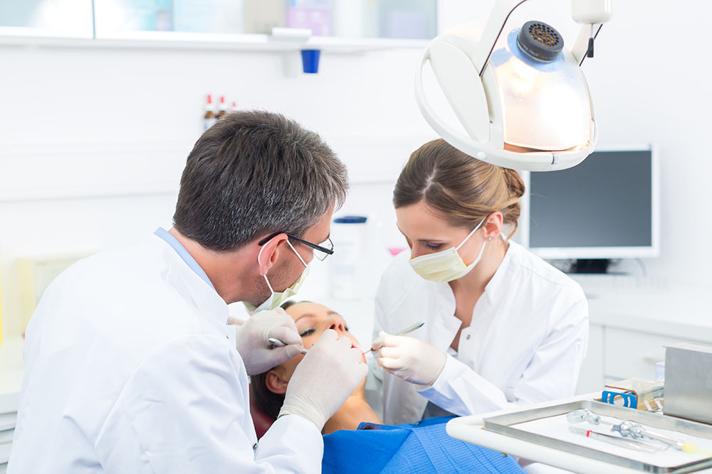 dentist working on a patient's teeth